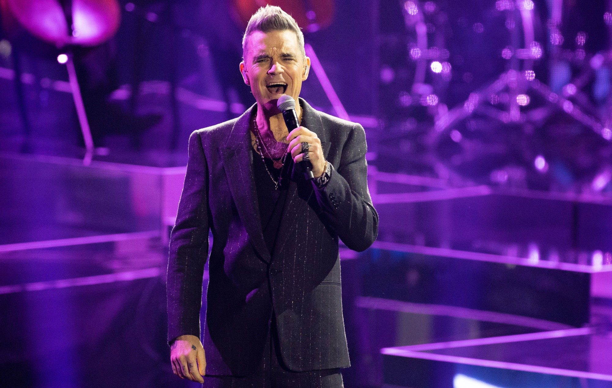 Robbie Williams sort le même fan au concert qu'il y a 20 ans